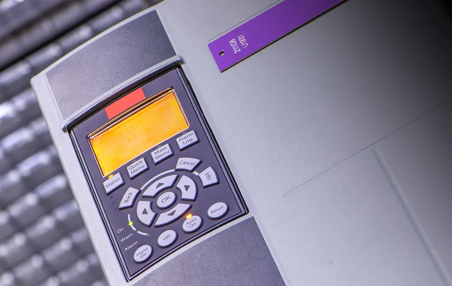 Close-up of a variable frequency drive keypad, a control used in commercial rooftop HVAC upgrades for Arizona facilities